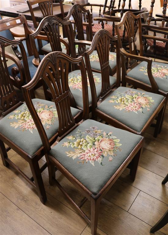 A set of six Hepplewhite style mahogany dining chairs, including two carvers, with drop-in seats